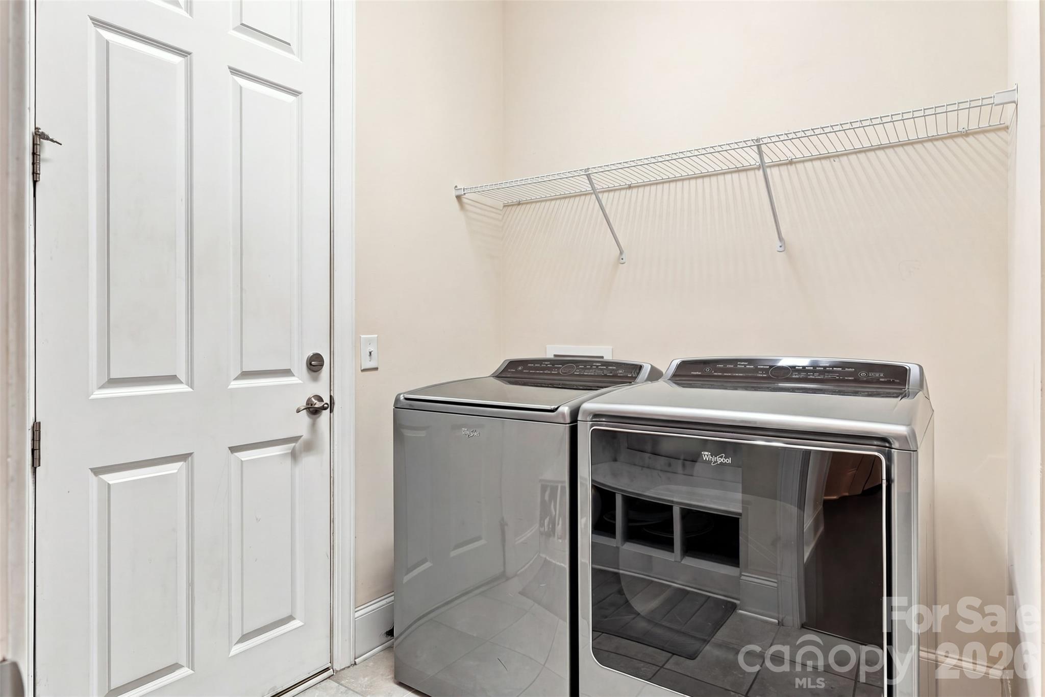 laundry/drop zone/ garage enterance- photo has been digitally altered to remove items on shelf - 131 Reserve Lane, Indian Land