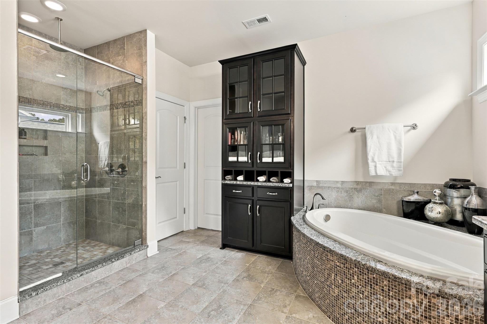 primary bathroom, his and hers sinks, ample cabinet space, garden tub, walk in shower - 131 Reserve Lane, Indian Land