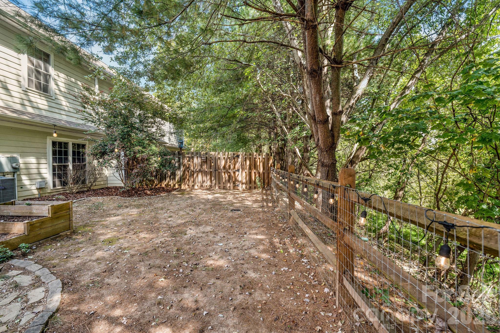Fenced in back yard is very private. - 896 West Pointe Drive, Asheville