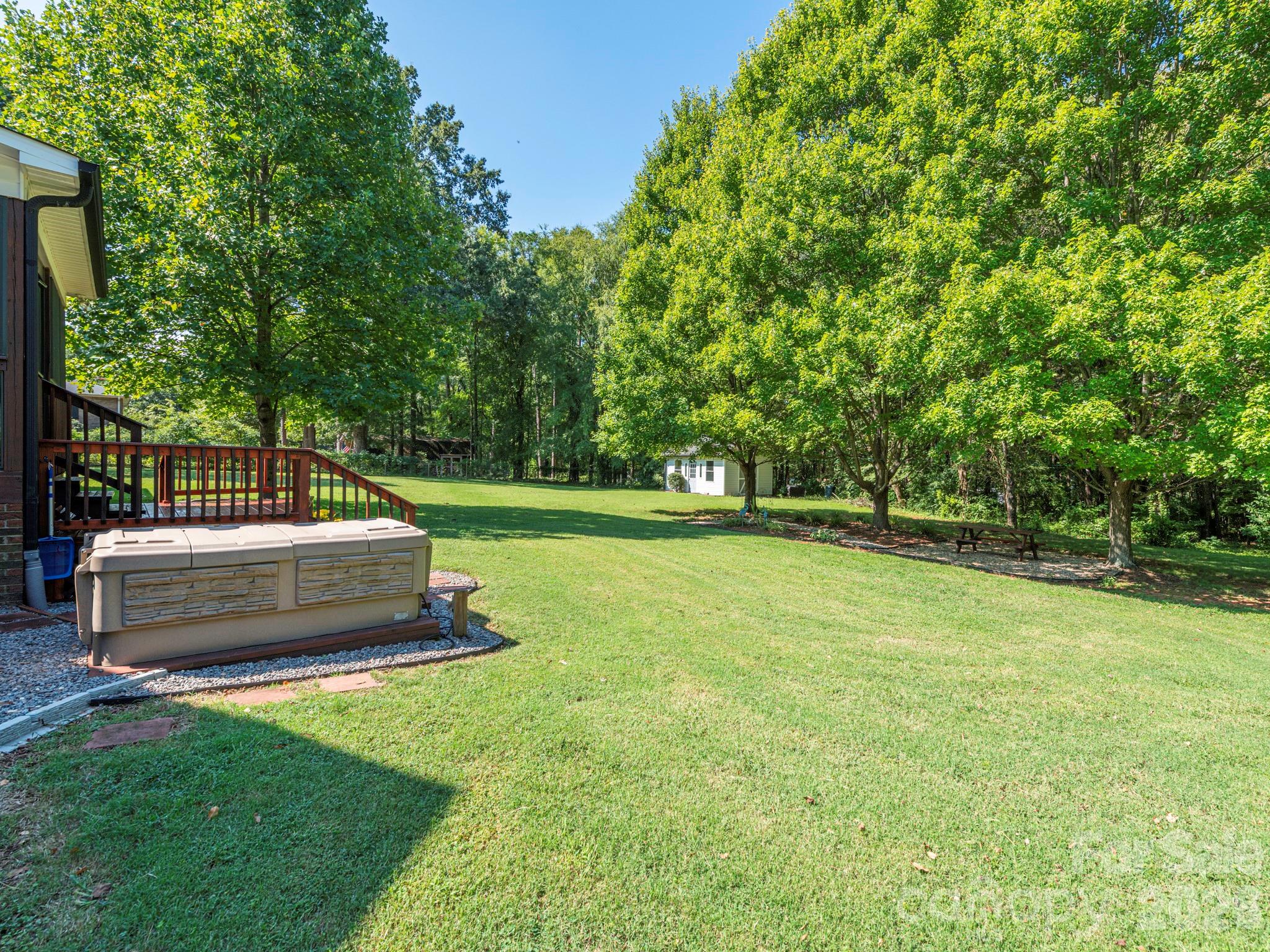 backyard with hot tub - 2434 Plantation Road NW, Concord
