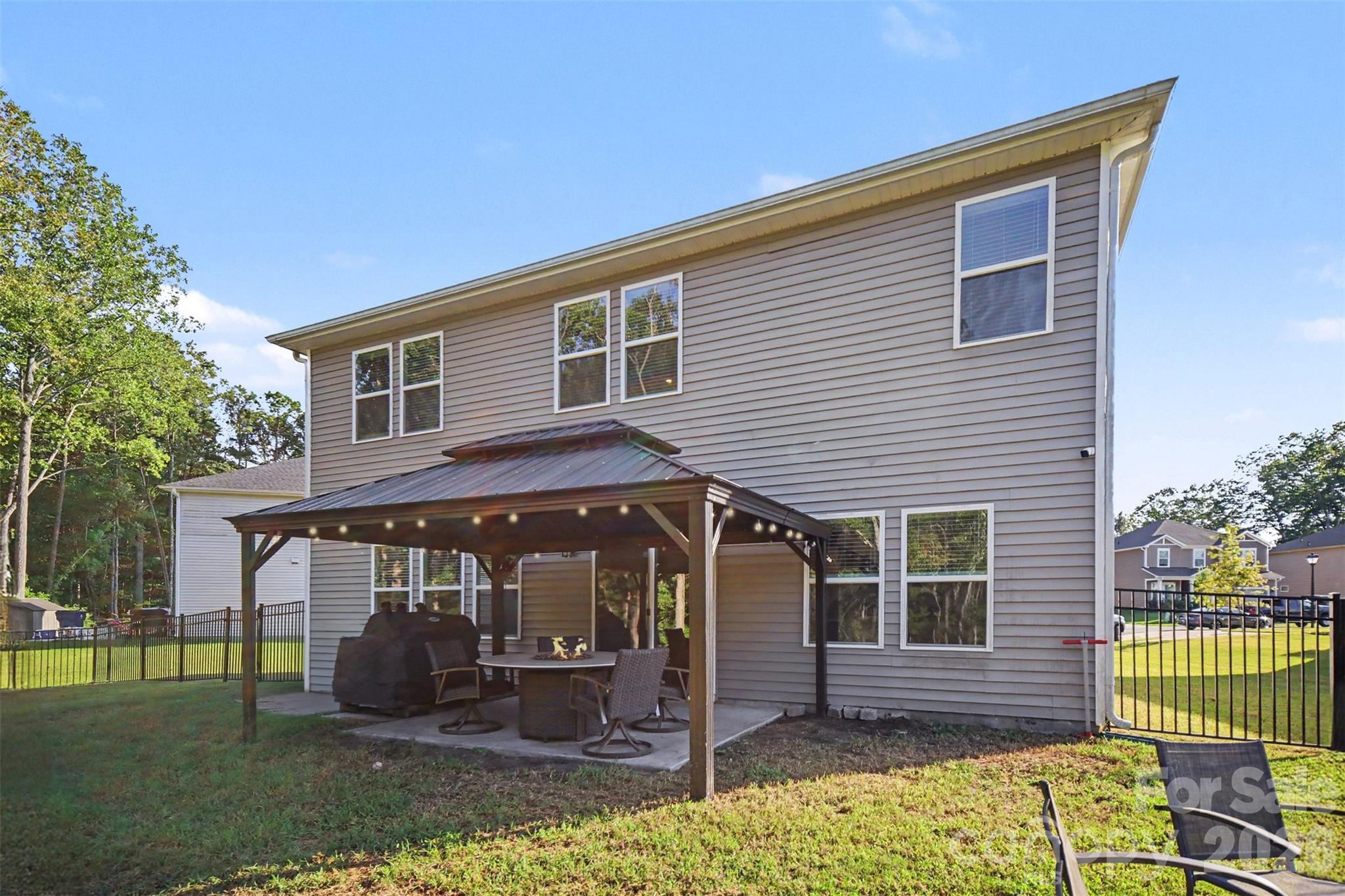 Relax on the covered patio, perfect for outdoor dining. - 1623 Baymont Court, Stanley