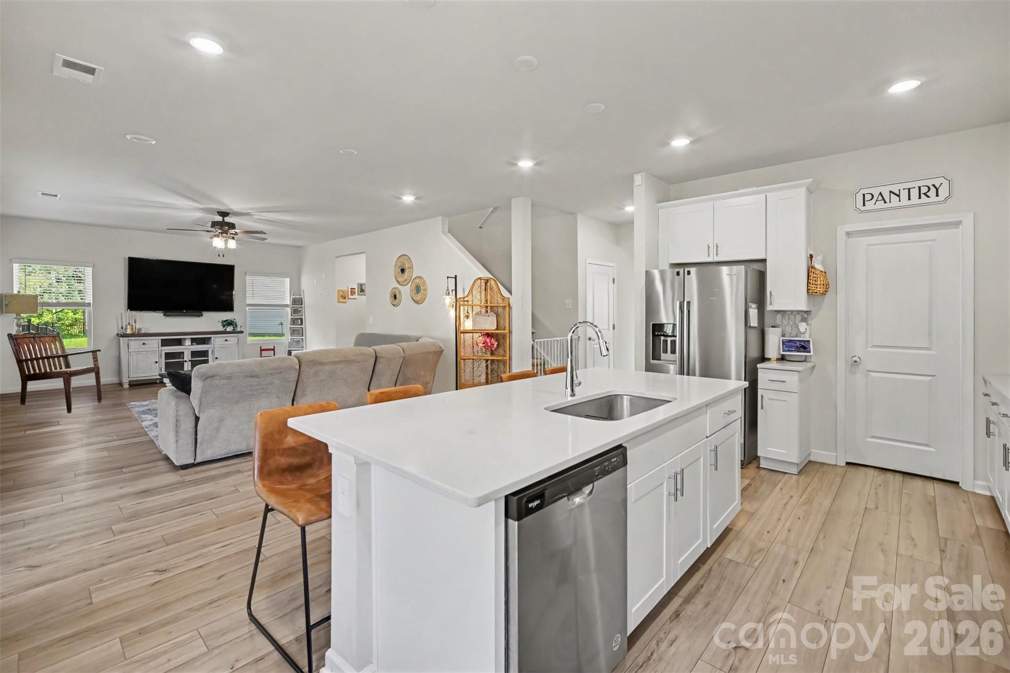 From the kitchen, the great room stays in view, making the whole main level feel connected. - 1623 Baymont Court, Stanley