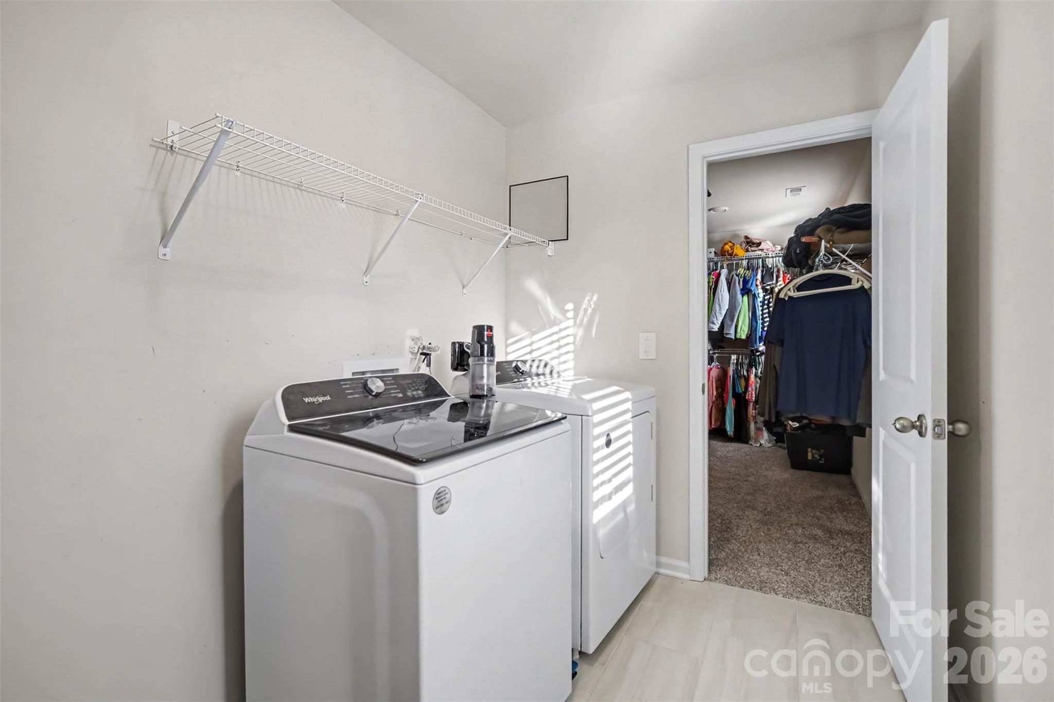 A dedicated laundry room with extra storage and direct access from the Primary bedroom closet. - 1623 Baymont Court, Stanley