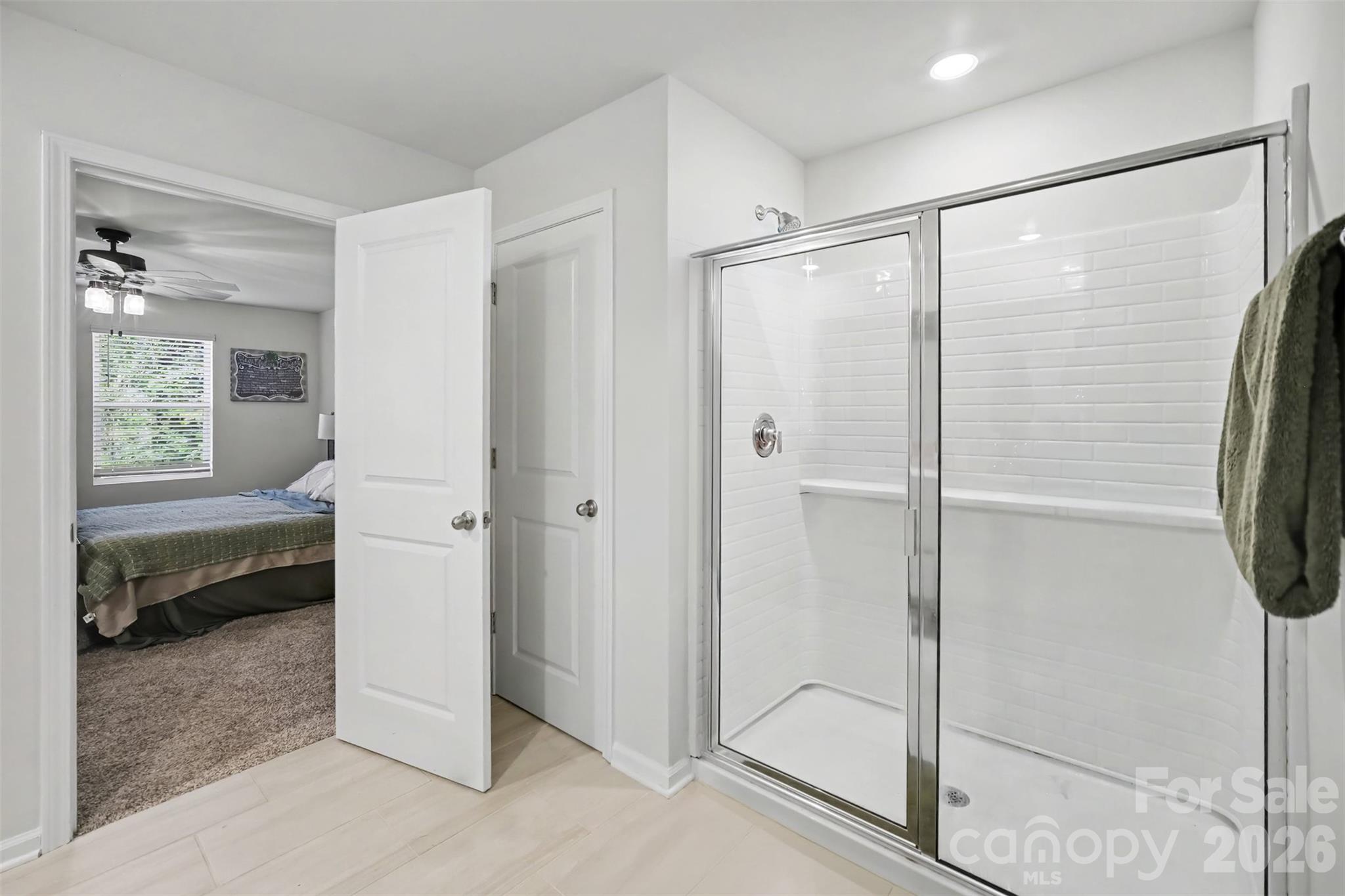 A walk in shower and linen closet just off the primary bath. - 1623 Baymont Court, Stanley