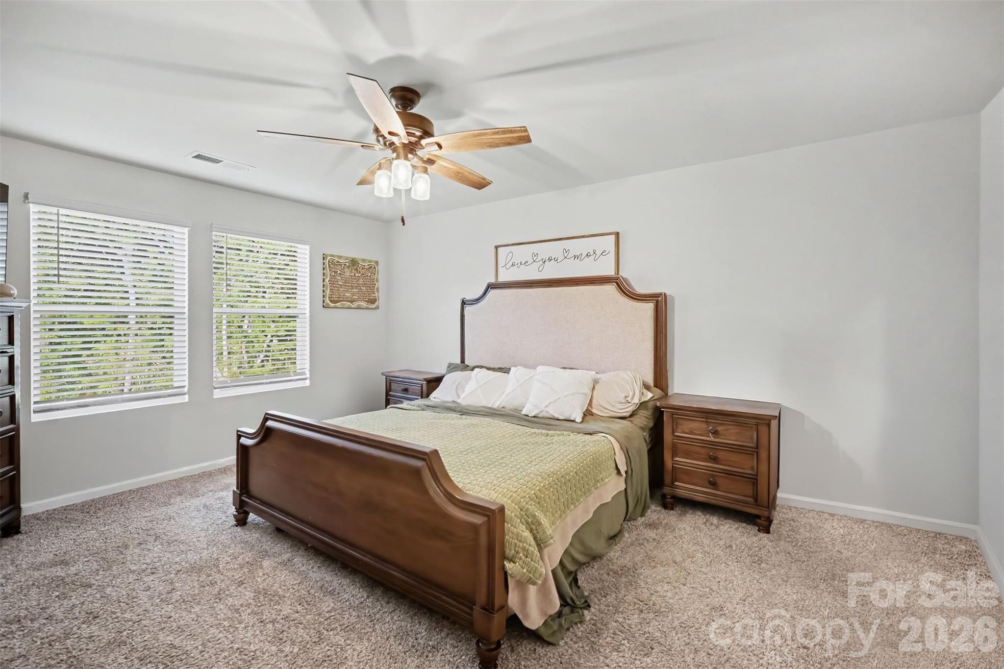 A spacious primary bedroom with room to unwind. - 1623 Baymont Court, Stanley
