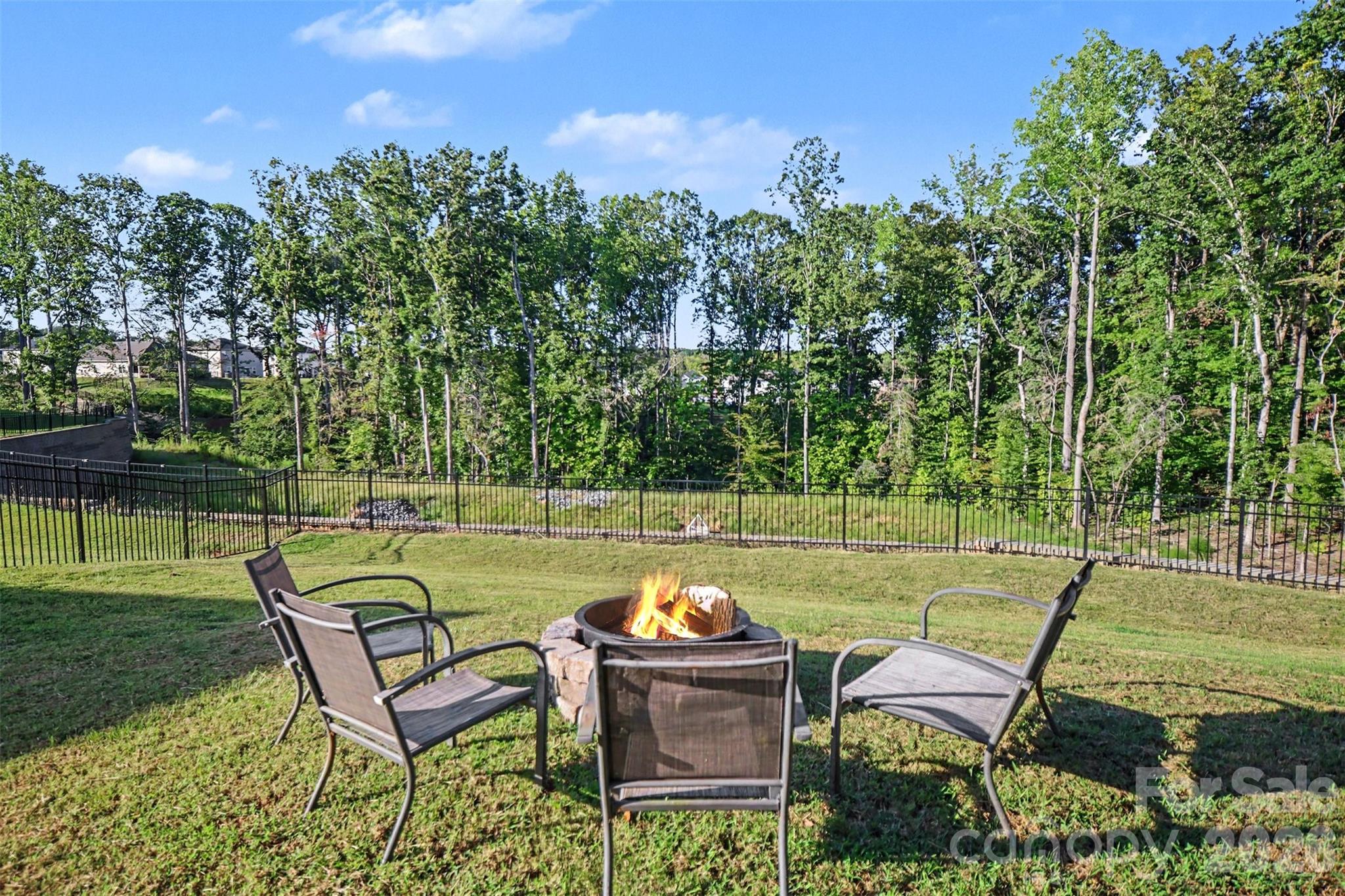 Gather around the fire pit on cool evenings. - 1623 Baymont Court, Stanley