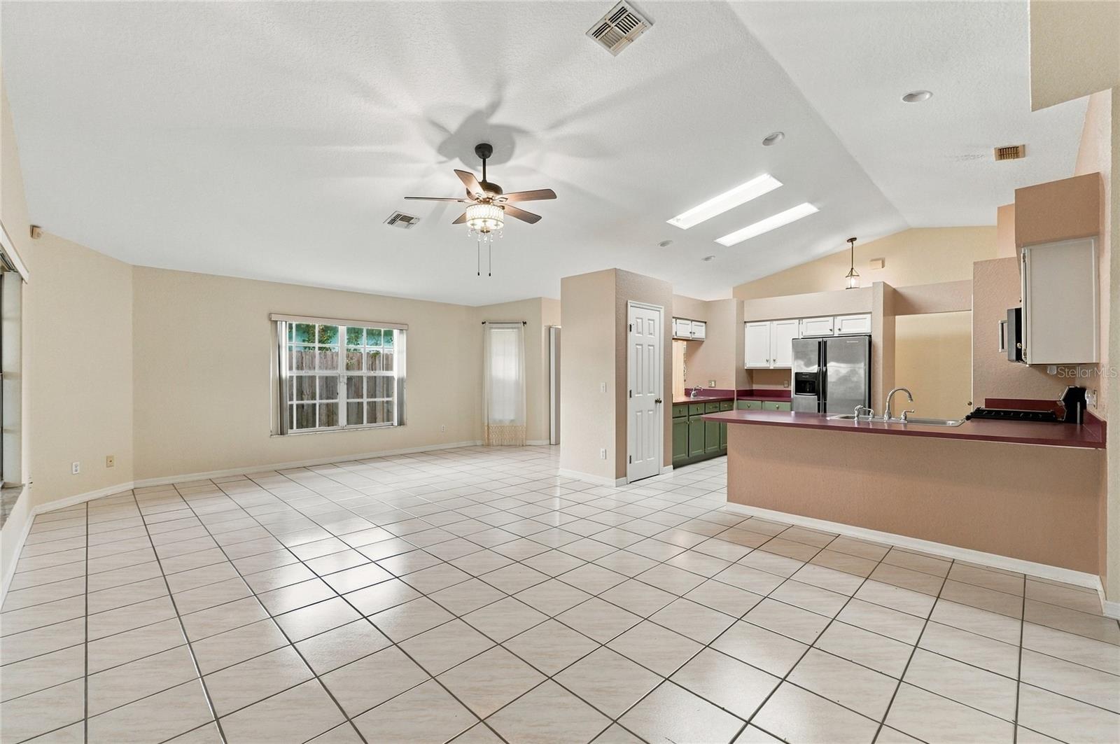 Dining & Living Area Off Kitchen - 511 MARCIA LOOP, WINTER HAVEN