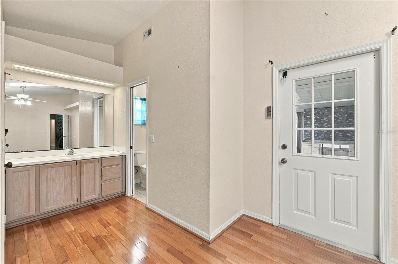Primary Vanity & Door to FL Room - 511 MARCIA LOOP, WINTER HAVEN
