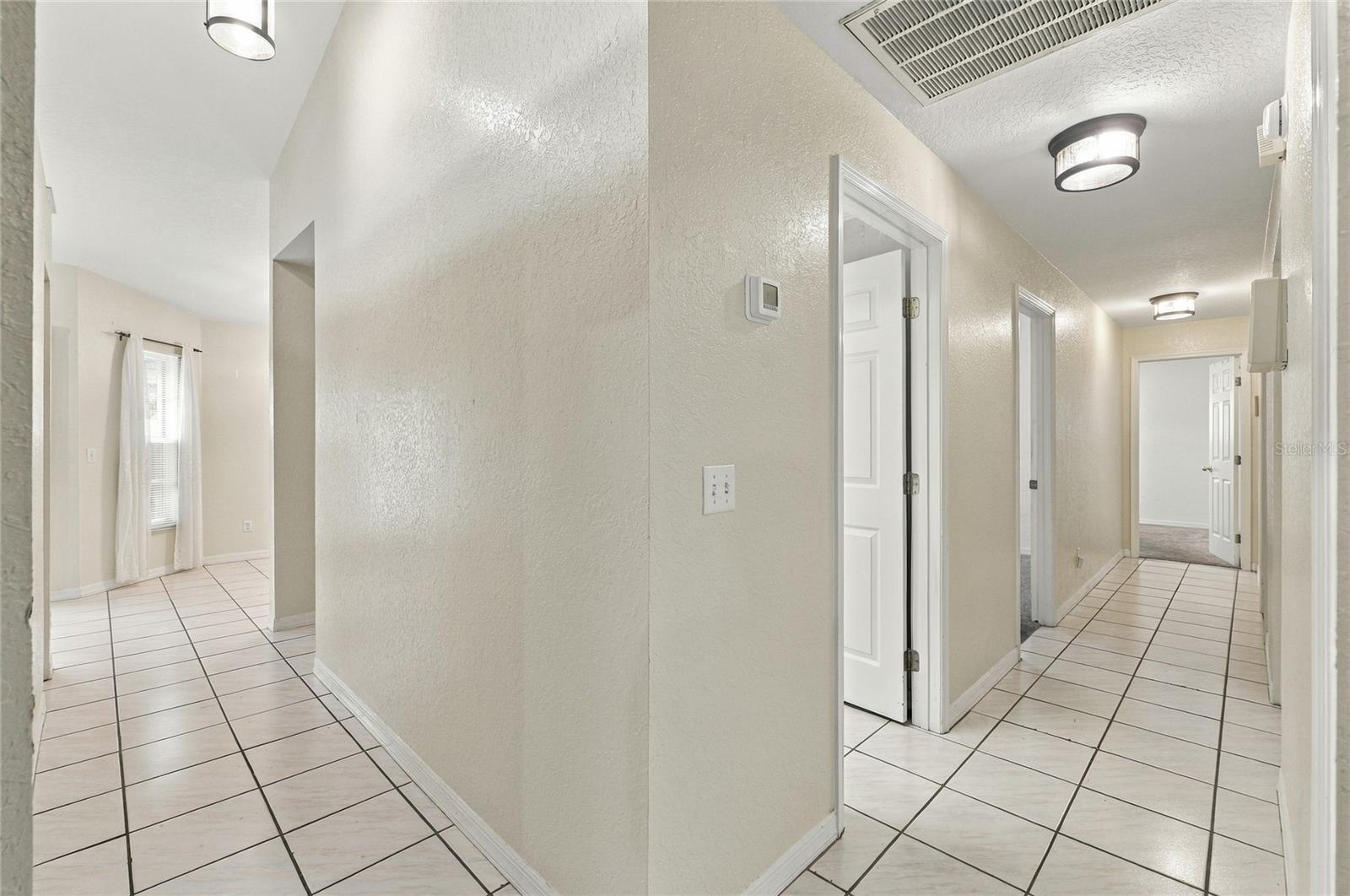 Hallway to Guest Bedrooms - 511 MARCIA LOOP, WINTER HAVEN
