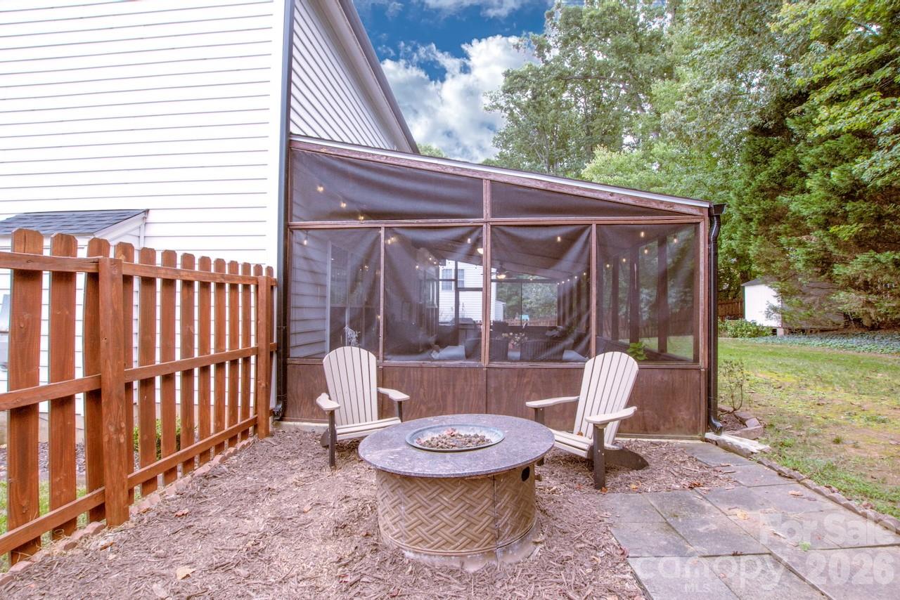 Fire pit area in fenced backyard - 111 Comata Road, Mooresville