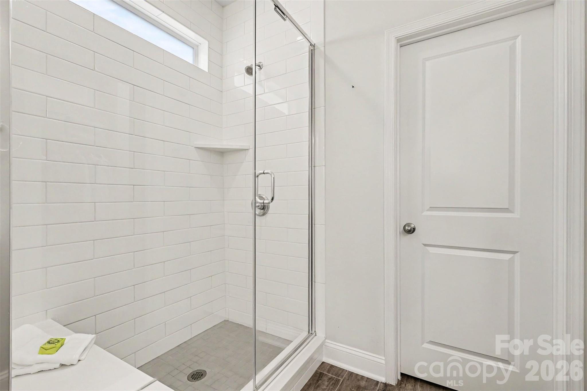 Primary bathroom with double vanity, large shower and water closet. - 6247 Six String Court, Fort Mill