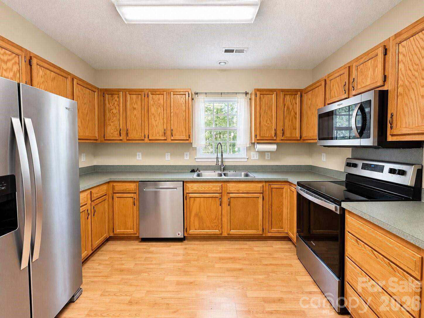 Kitchen with stainless steel appliances - 4075 Zebulon Avenue SW, Concord