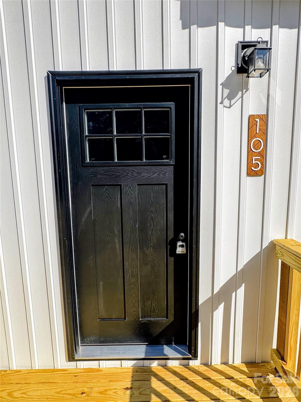 front exterior with vertical siding - 105 Cottontail Lane, Statesville
