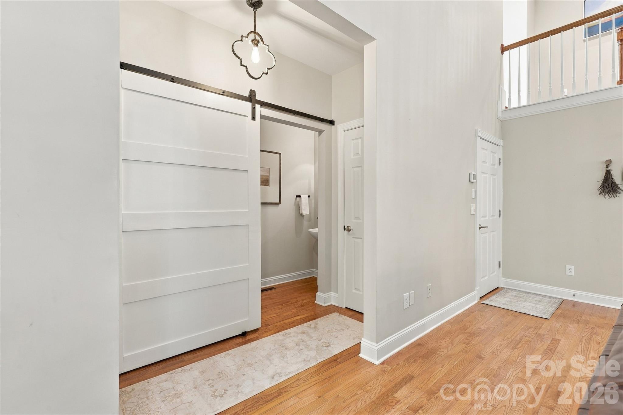 Barn door leading to powder room - 3105 Stanway Court, Waxhaw