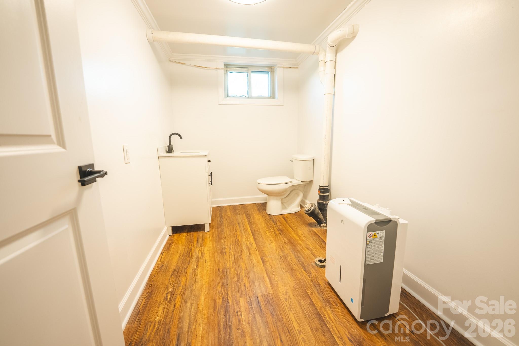 Basement 1/2 bath is plumbed for shower - 3490 Church Road, Taylorsville