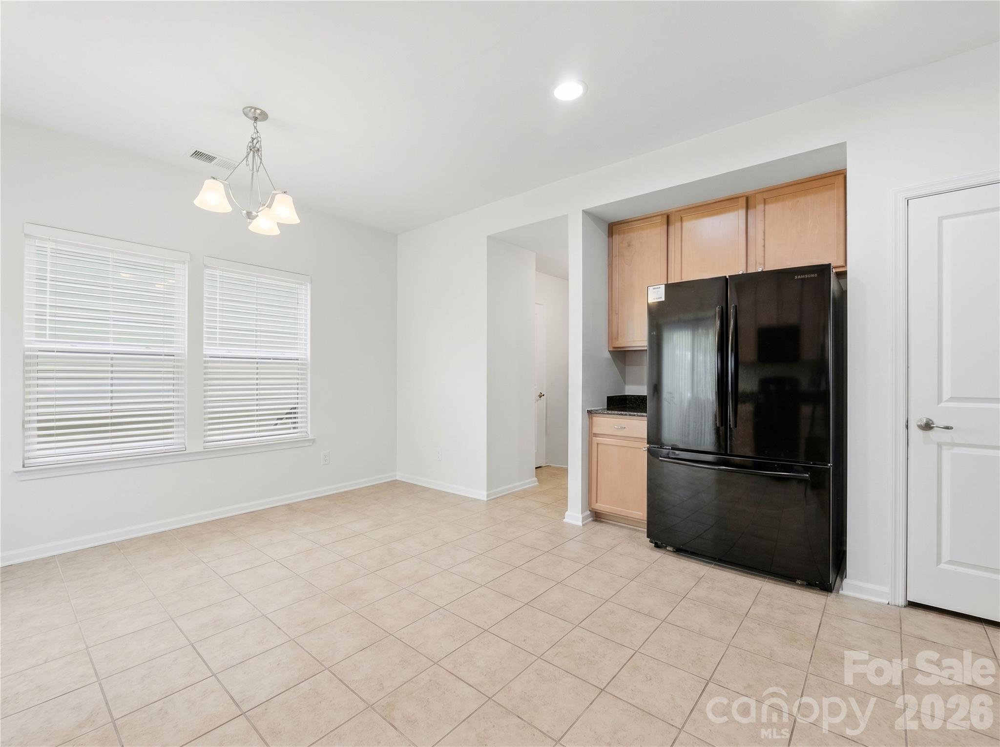 Kitchen: Additional kitchen view highlighting the expansive breakfast area. - 3341 Linetender Drive, Davidson