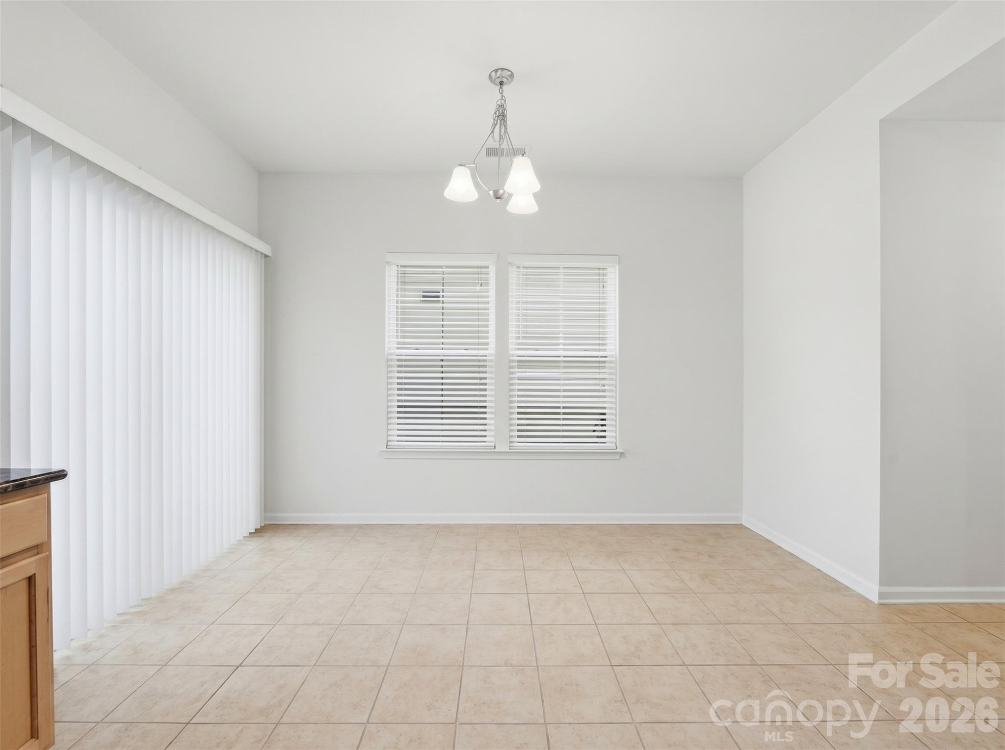 Breakfast Nook: Bright breakfast area with backyard views and room for casual dining and direct access to the backyard patio. - 3341 Linetender Drive, Davidson