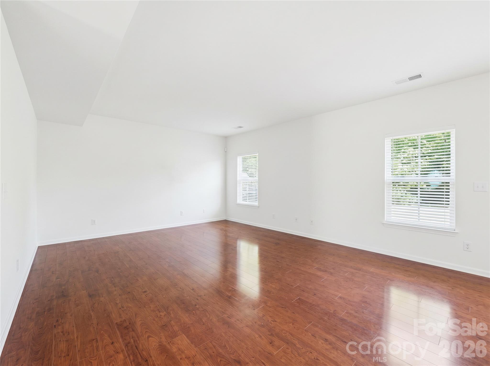 Living Room: Spacious living room with hardwood flooring and an open layout ideal for everyday living and entertaining. - 3341 Linetender Drive, Davidson
