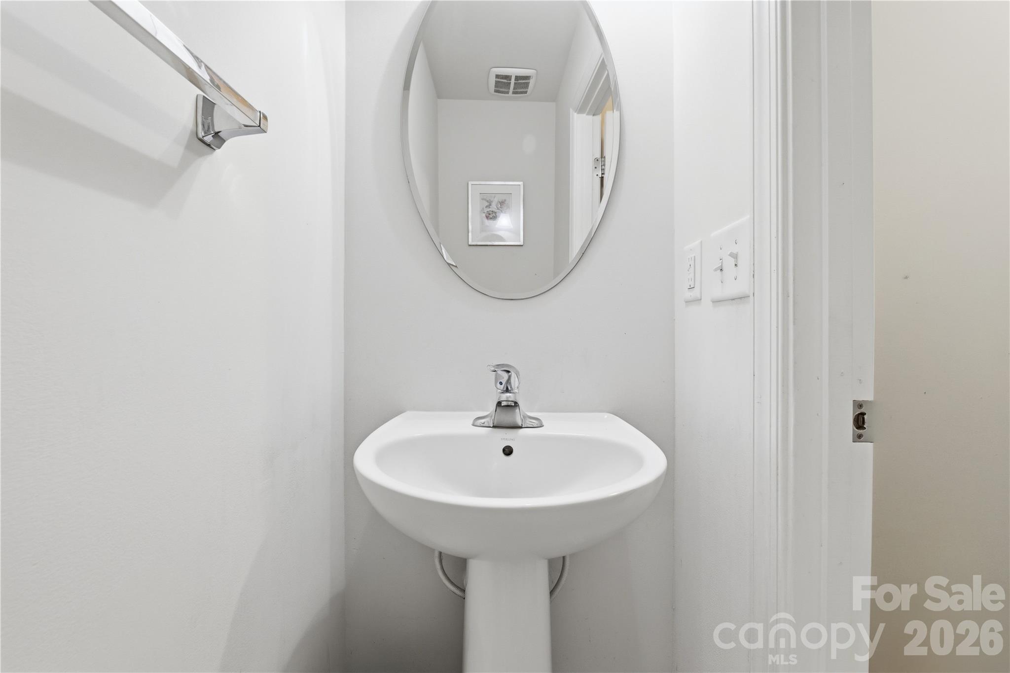 Powder Room: Convenient main-level powder room ideally positioned for guests and everyday use. - 3341 Linetender Drive, Davidson