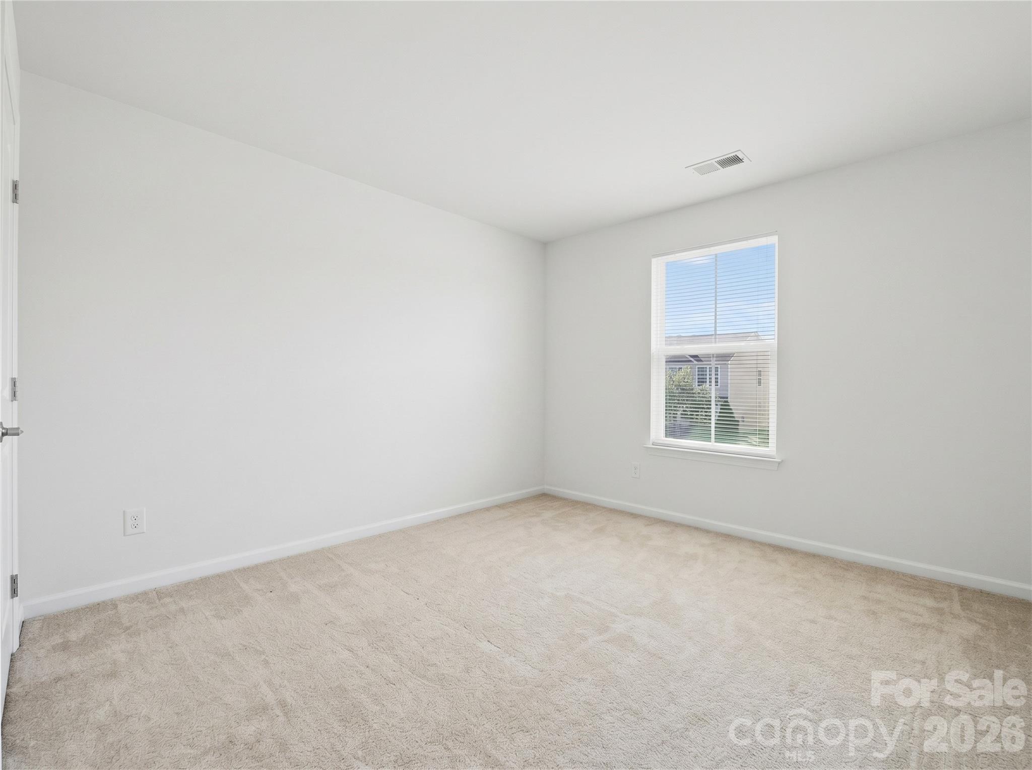 Bedroom 3: Comfortable secondary bedroom suitable for family, guests, or additional workspace. - 3341 Linetender Drive, Davidson
