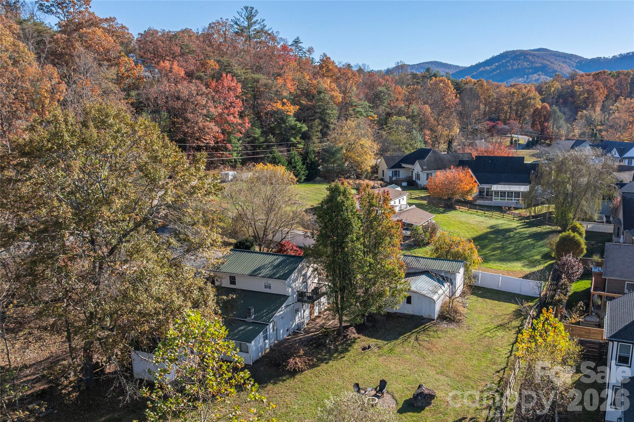 Aerial footage looking at the back of the home and backyard - 223 Davidson Road, Swannanoa