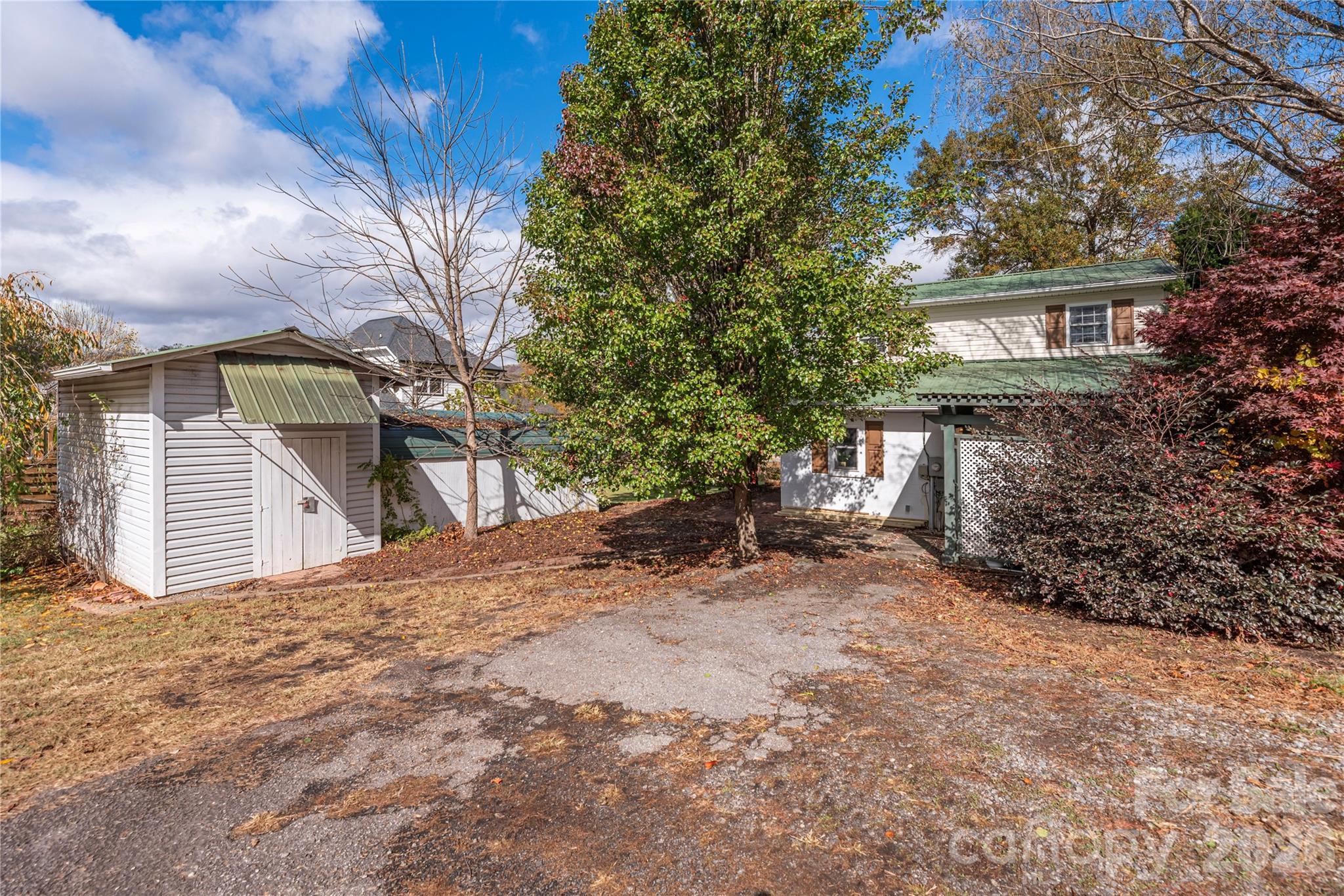 Facing side of the home and Storage outbuilding - 223 Davidson Road, Swannanoa