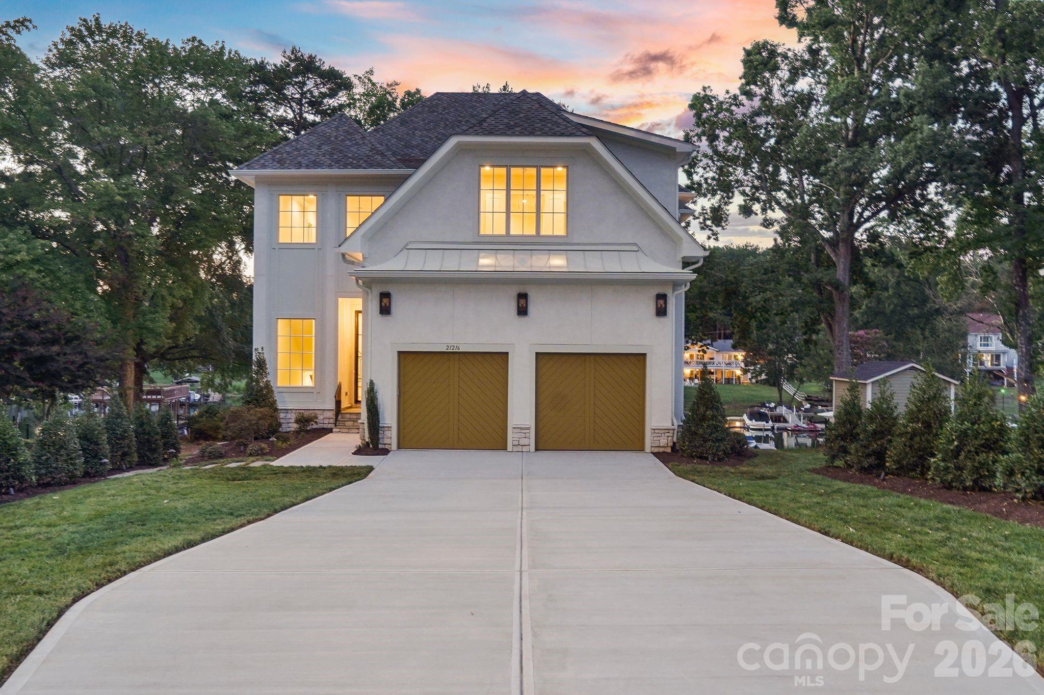 Stunning luxury new construction showcasing timeless architecture, elevated exterior finishes, and exceptional curb appeal. - 21216 Rio Oro Drive, Cornelius