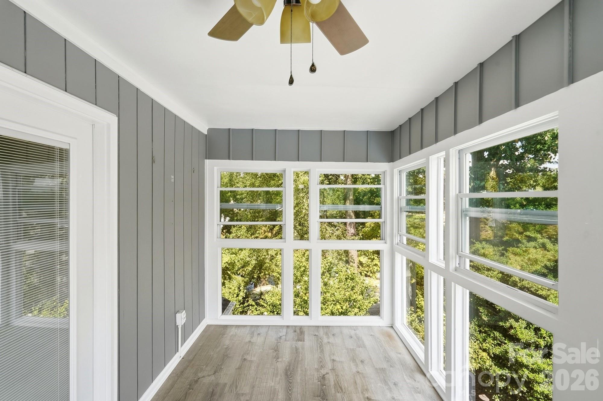 Beautiful four-season sunroom off the primary bedroom, creating a bright and peaceful extension of the suite. - 3022 Point Clear Drive, Tega Cay