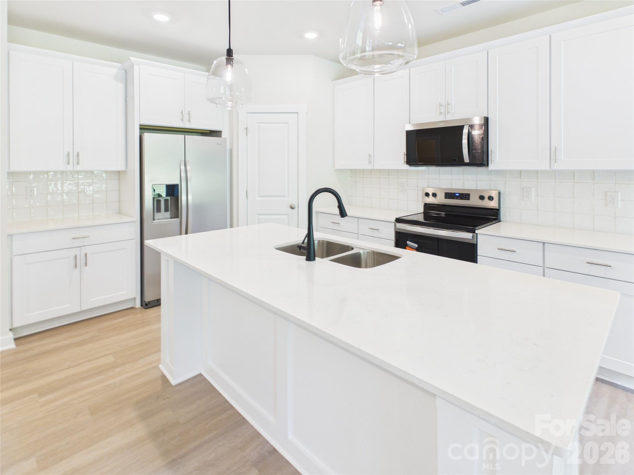 Stainless refrigerator, range, microwave and dishwasher included. - 105 Dilling Street N, Kings Mountain