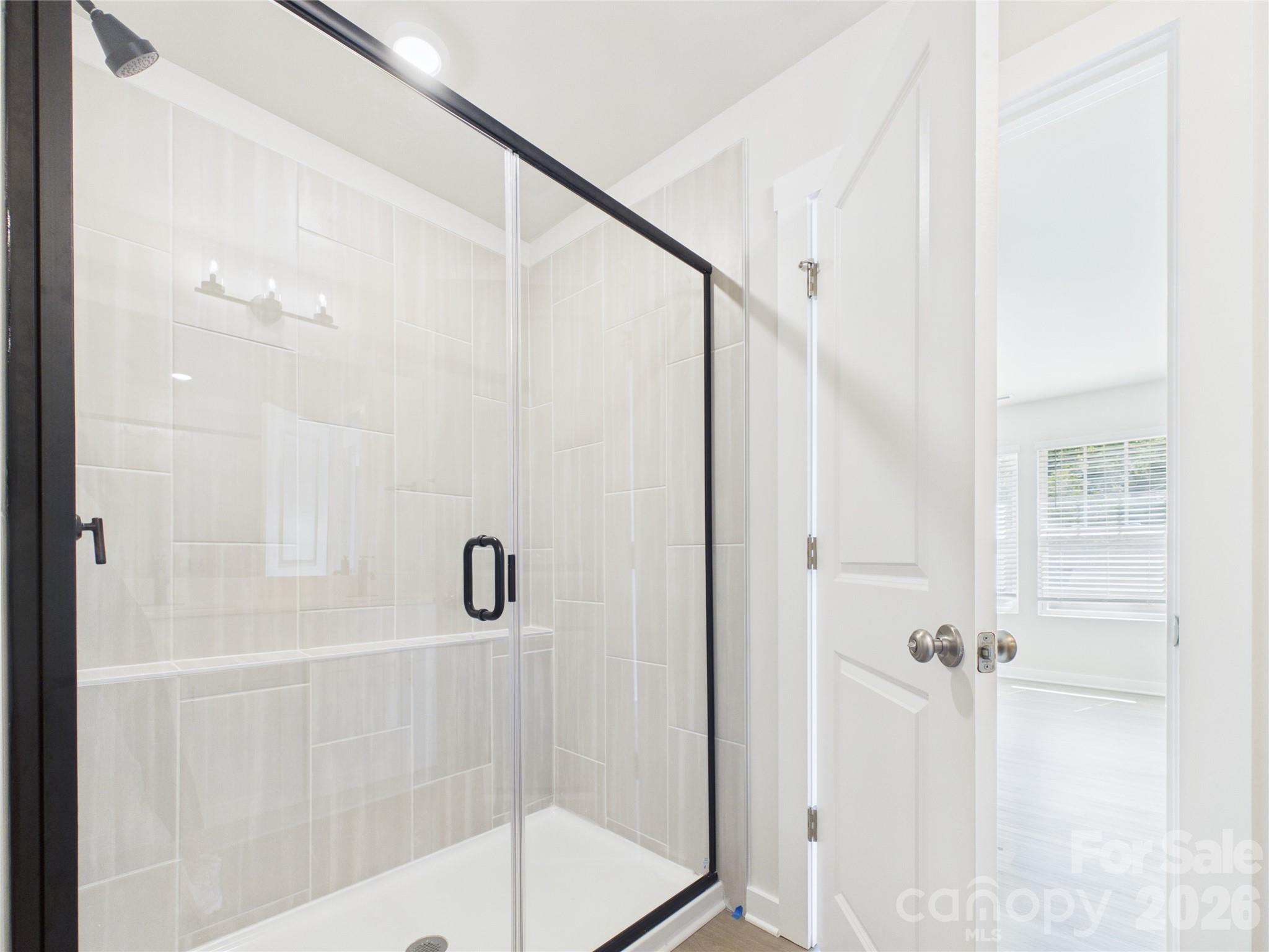Primary Bath with tile shower and modern black finishes - 105 Dilling Street N, Kings Mountain