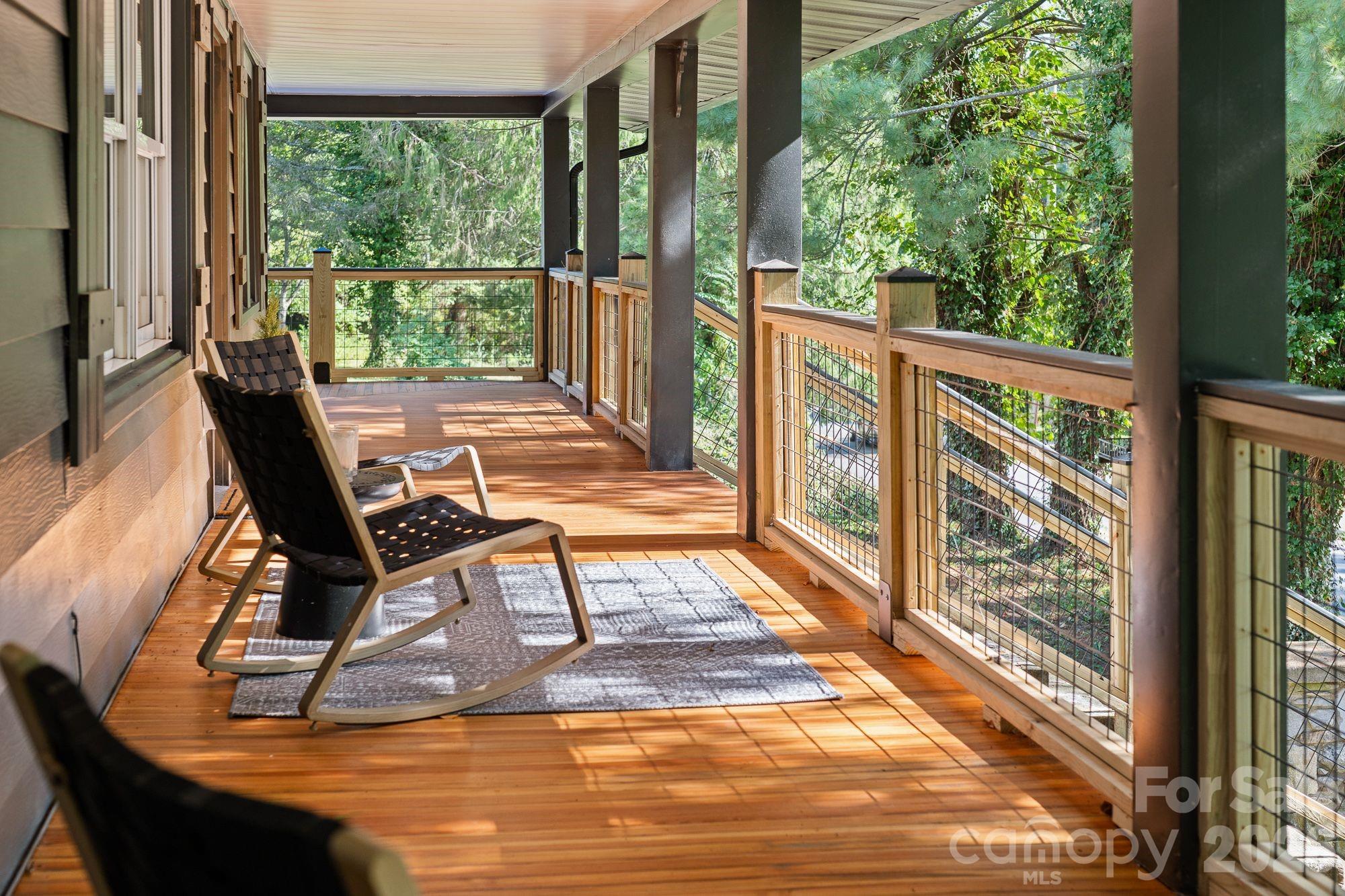 Enjoy morning coffee or evening gatherings on the expansive covered porch. - 156 State Street, Asheville