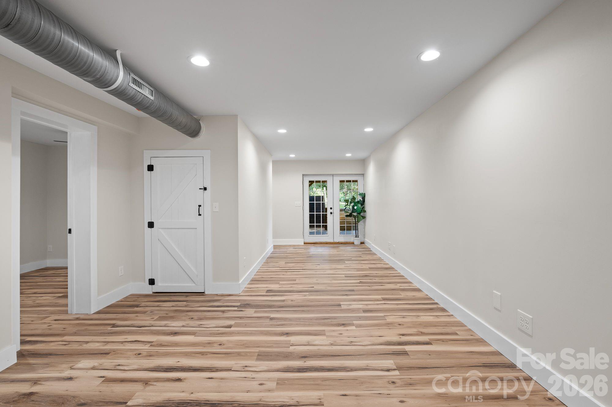 Lower-Level Den: Expansive den with a separate entrance to lower level. - 156 State Street, Asheville