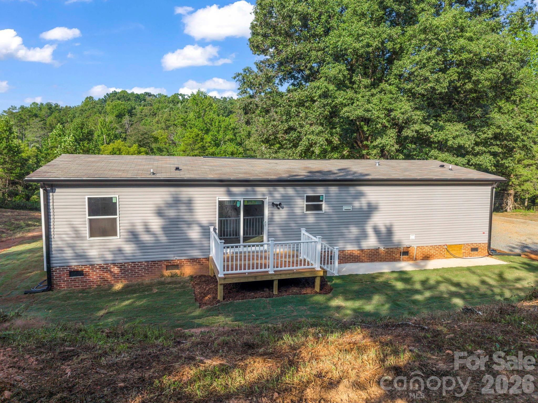 Back of Home w/Concrete Walkway - 184 Crawford Hollow, Rutherfordton