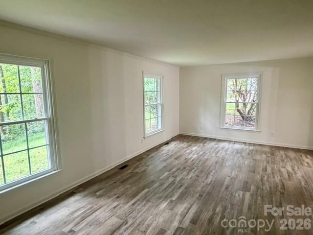 LR with LVP flooring, freshly painted - 845 Cherokee Place SW, Lenoir