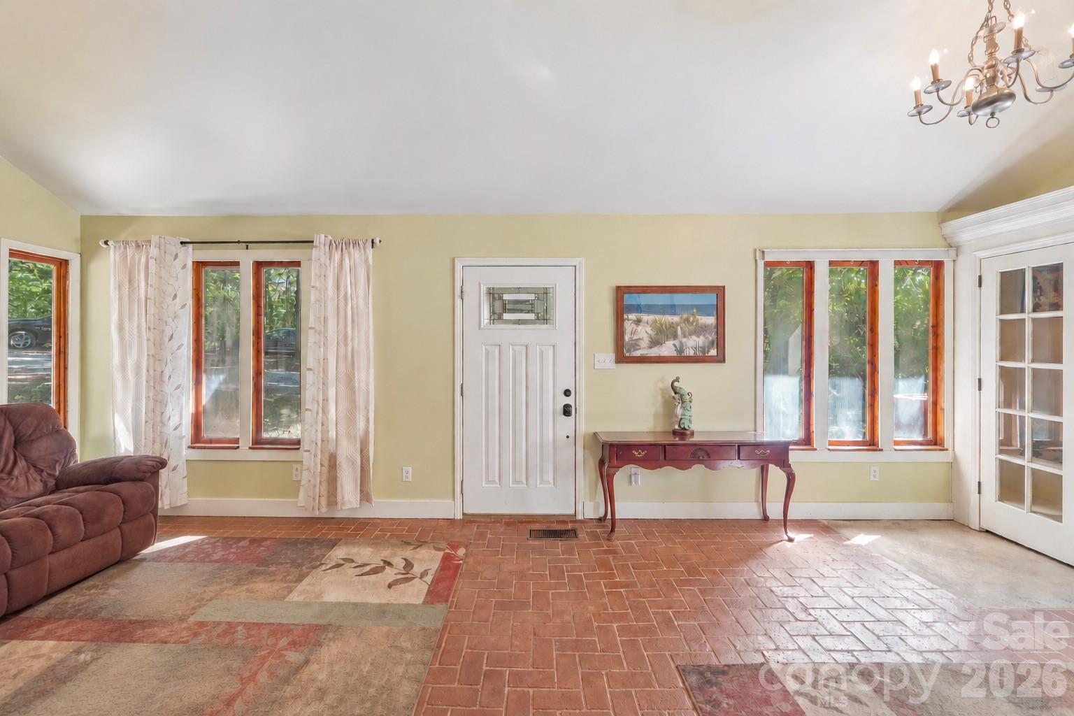 Spacious 2-story, entry-way with brick flooring. - 2701 Cedar Trail Lane, Wingate