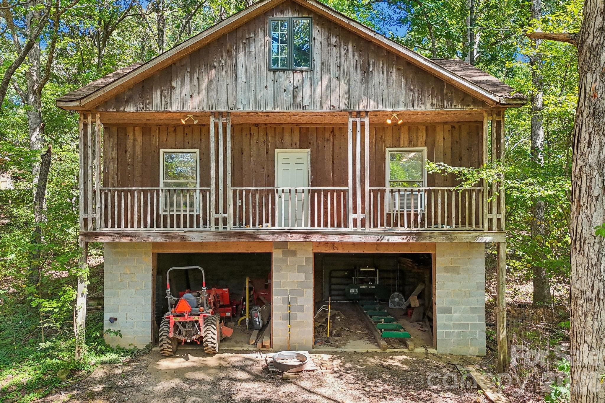 Secondary building with 2 car-garage and workshop on top. - 2701 Cedar Trail Lane, Wingate