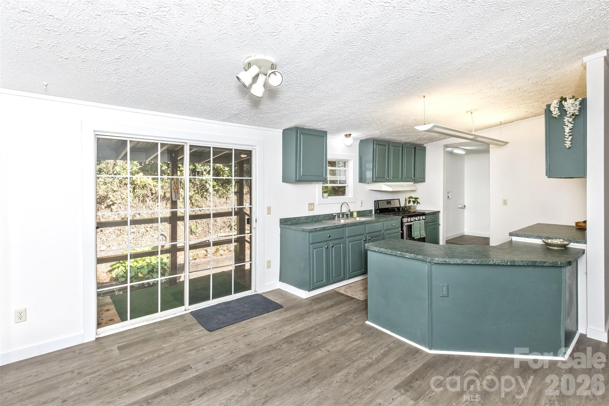 Dining/Kitchen leads to back porch.... - 13 Cattail Drive, Sylva