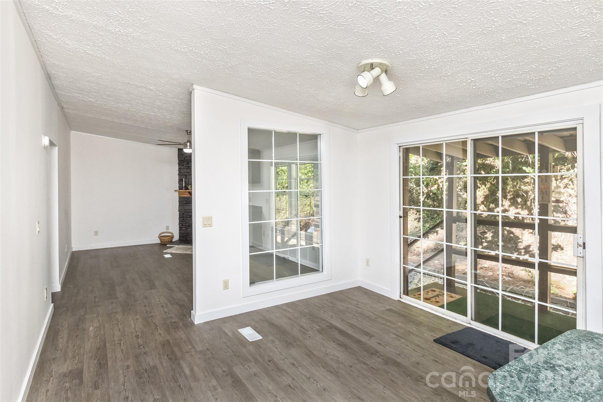 Kitchen and Dining flow into Family Room - 13 Cattail Drive, Sylva