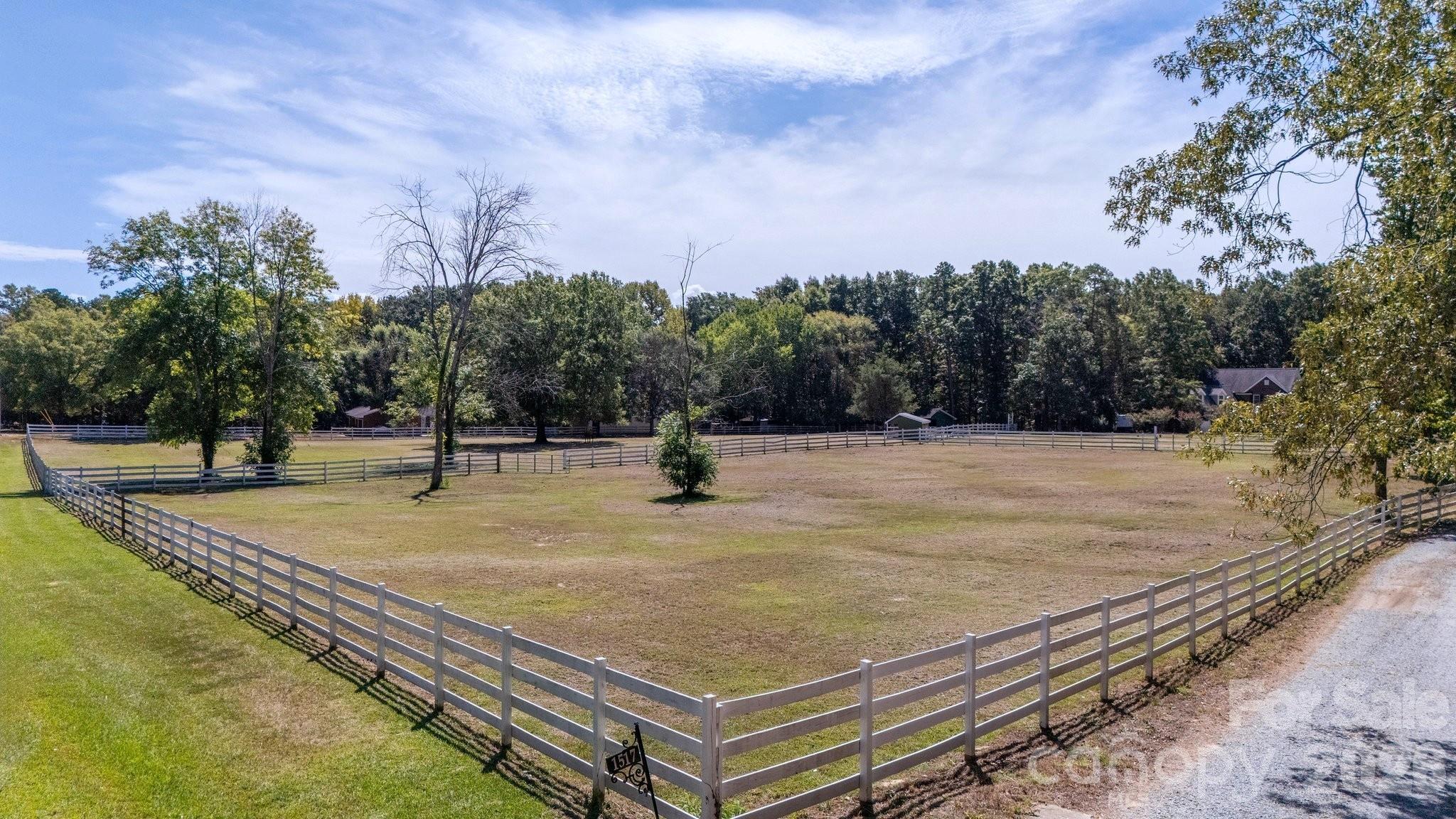 4 board fencing on street side of home andin arean - 1517 Helms Short Cut Road, Monroe