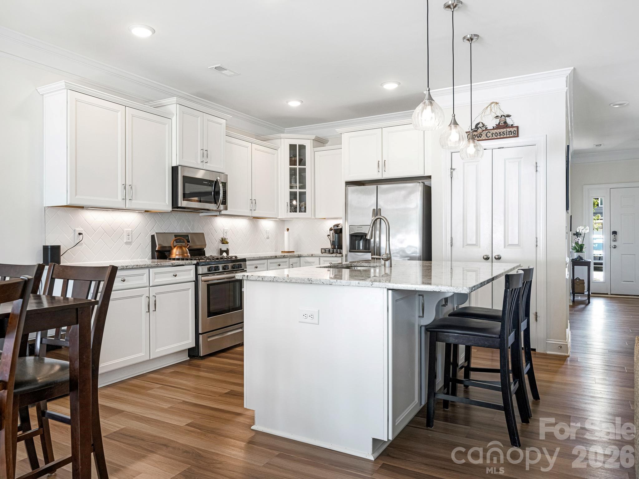 Open concept kitchen next to breakfast nook - 6008 Hampstead Pond Lane, Matthews