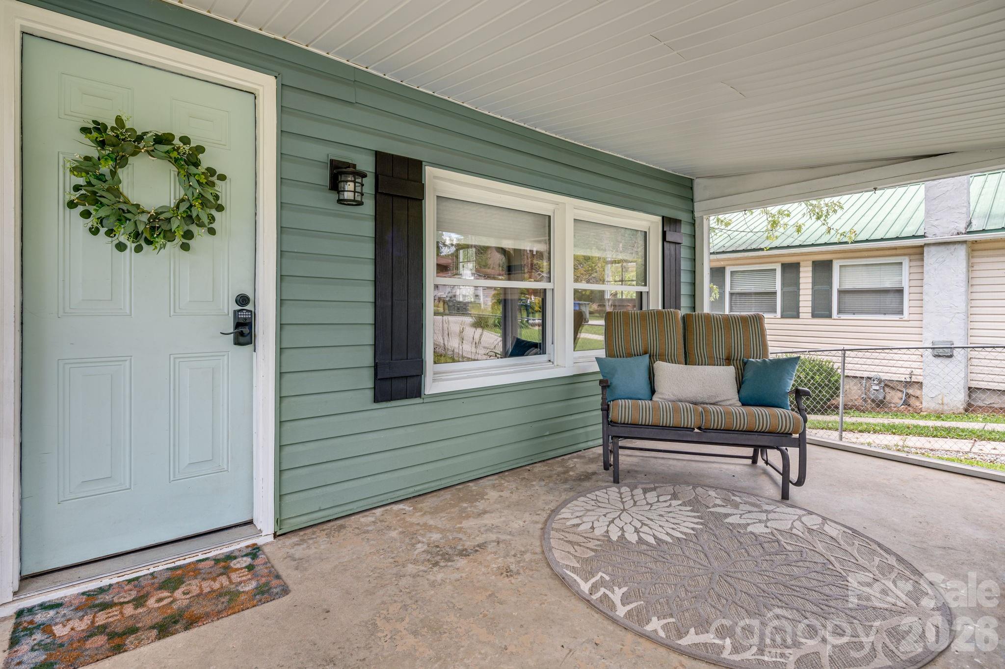 Large screened area with a concrete floor. - 1015 Mountain View Street, Hendersonville