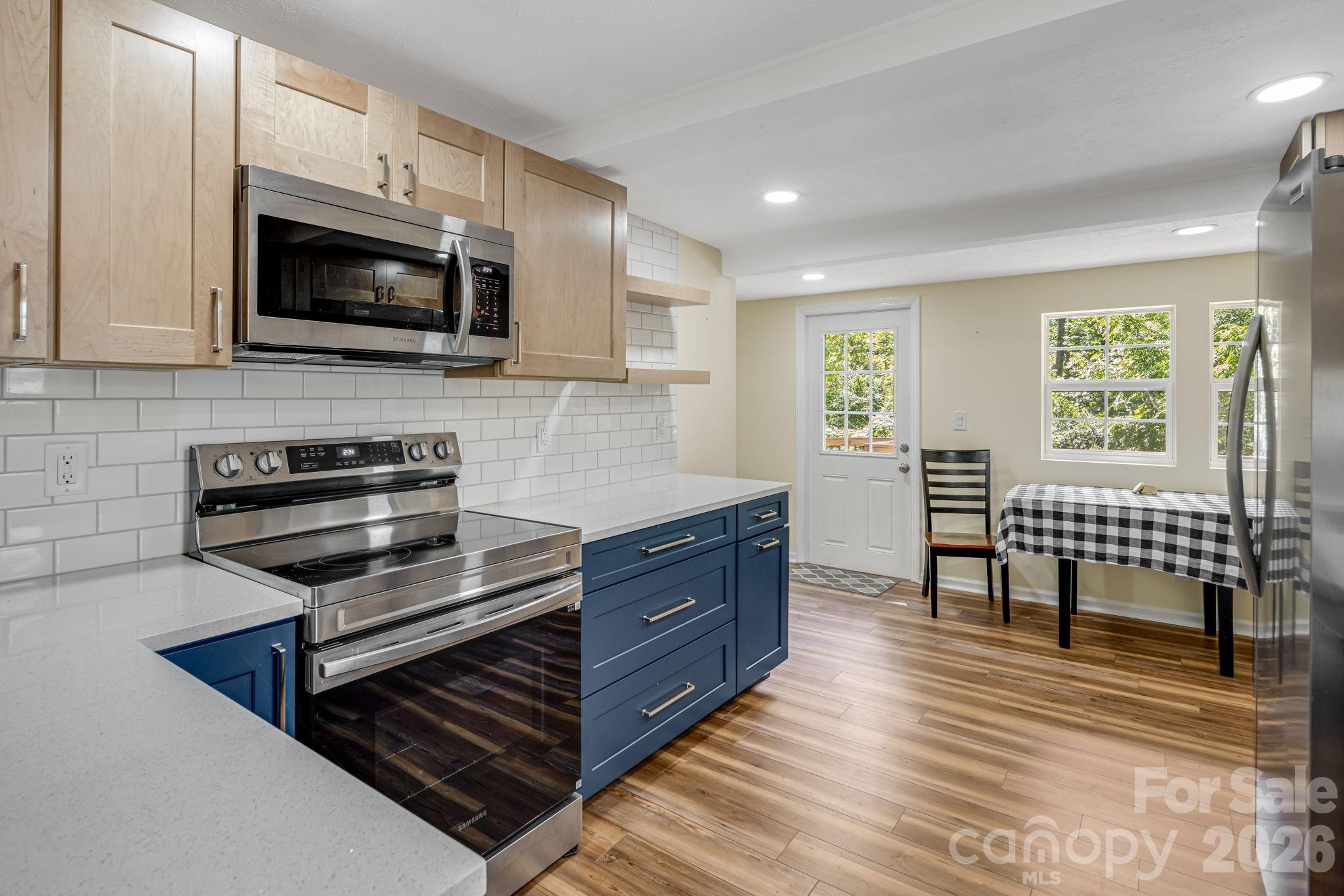 Quartz countertops, tile backsplash. Quality appliances. - 1015 Mountain View Street, Hendersonville