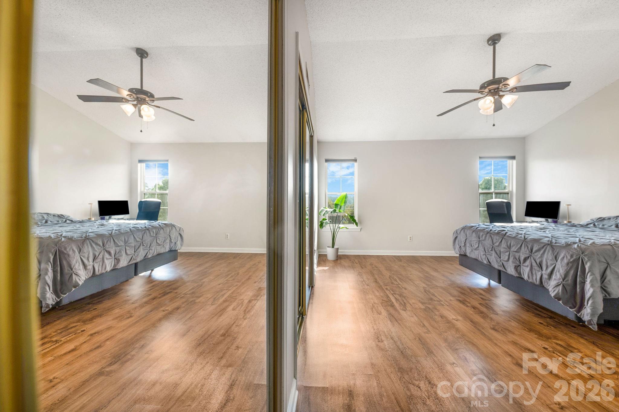 Primary bedroom with vaulted ceiling and plenty of space. - 4702 Breakers Lane, Asheville