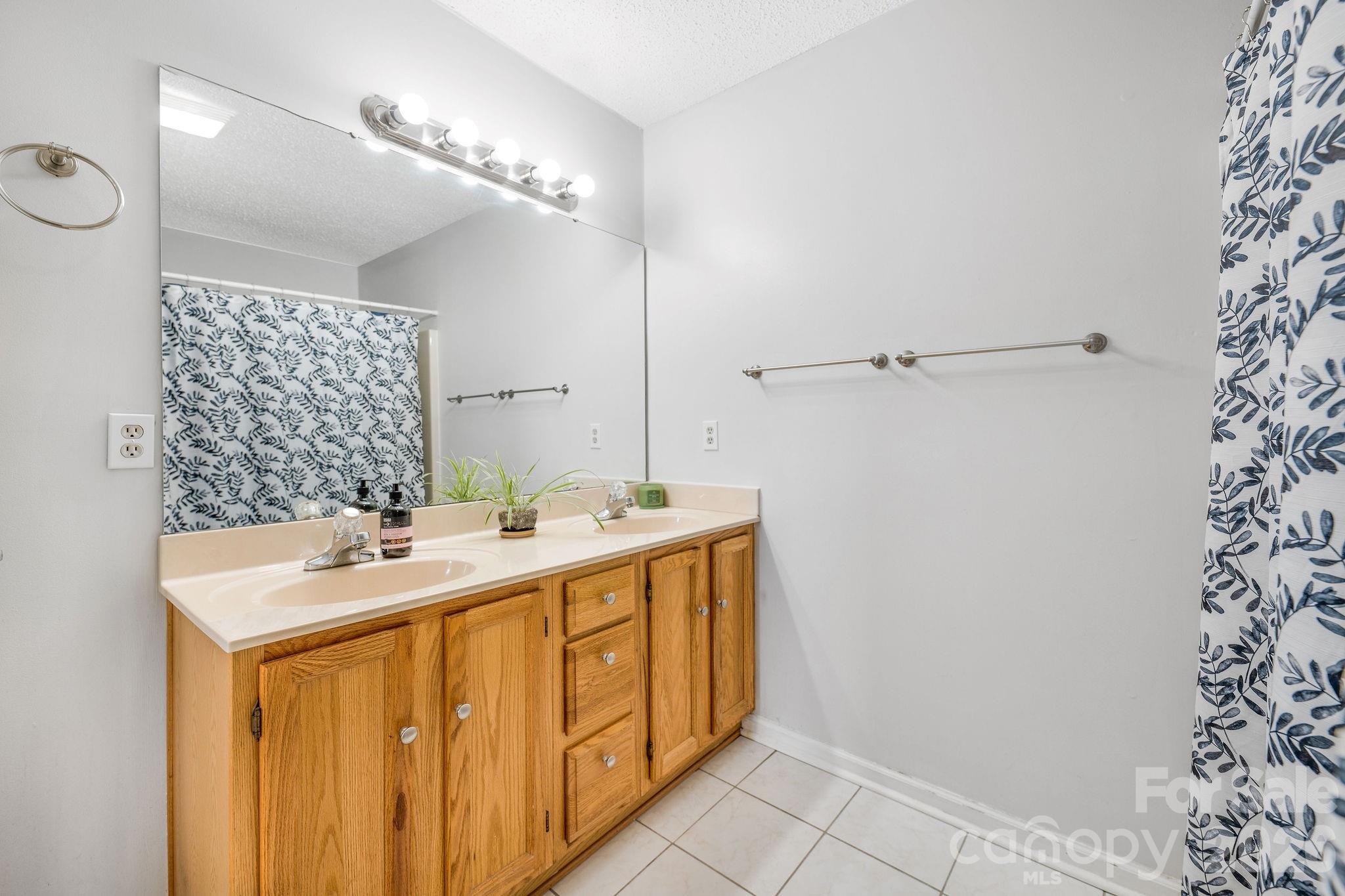 Double vanities in primary bedroom - 4702 Breakers Lane, Asheville