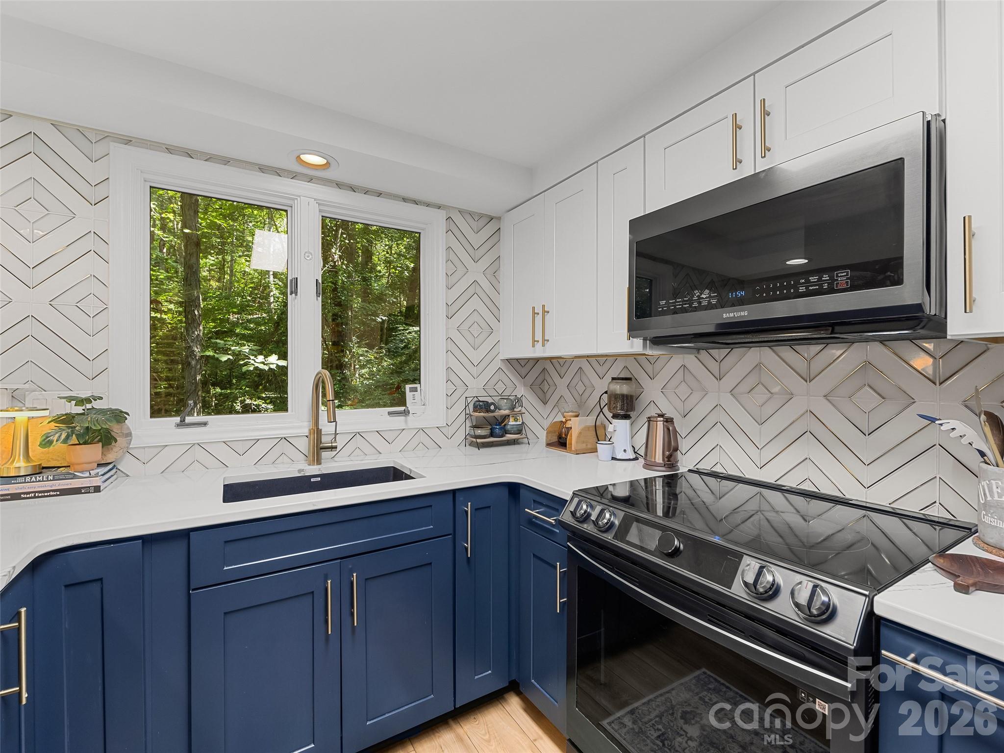 Open kitchen with new stainless steel appliances - 16 Cedarwood Drive, Asheville