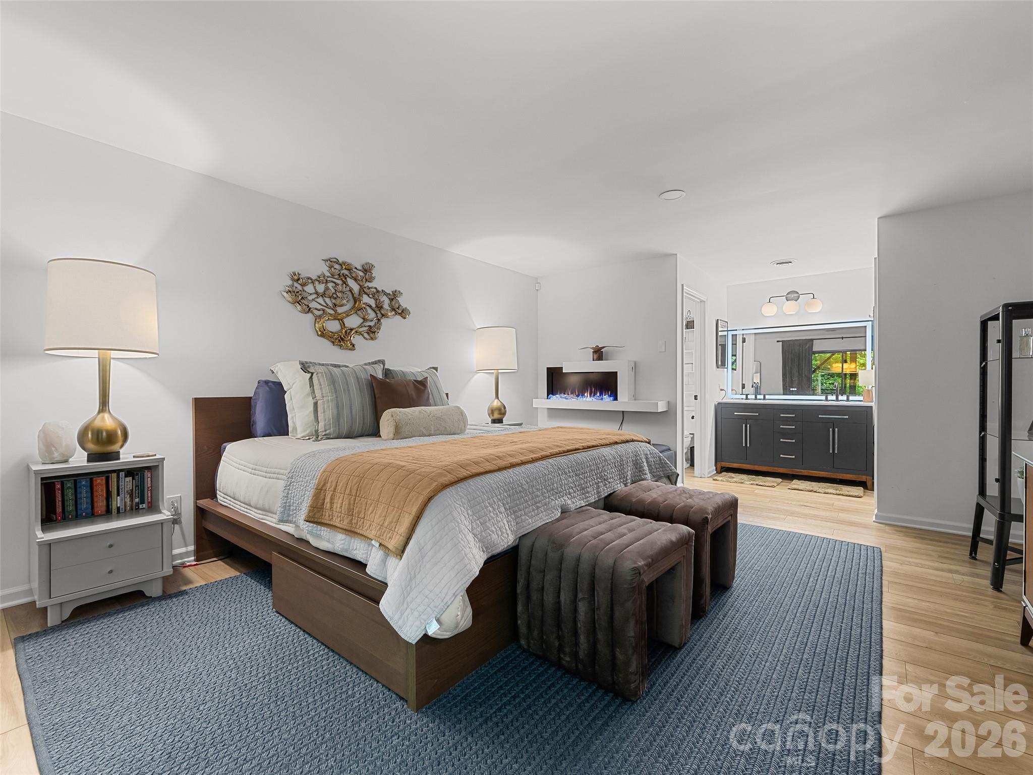 Lower-level bedroom (could also serve as primary) with en-suite bathroom - 16 Cedarwood Drive, Asheville