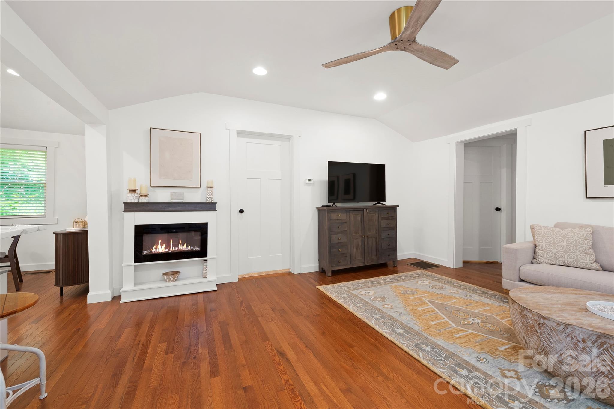 With bedrooms to the right off the living room and the kitchen and dining room off to the left. - 121 Sugar Cove Road, Weaverville