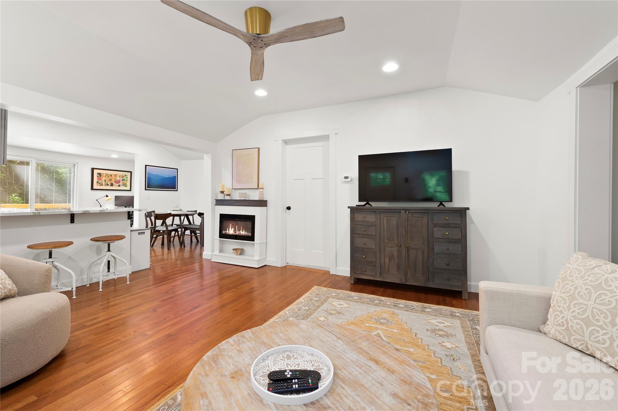 A breakfast bar frames the entrance to the kitchen. - 121 Sugar Cove Road, Weaverville
