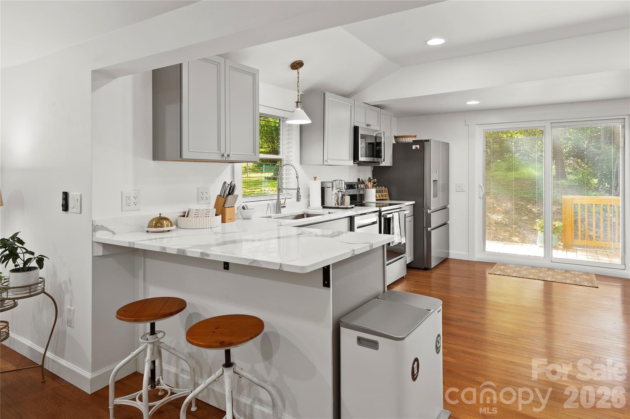 The breakfast bar allows for extended counter space. - 121 Sugar Cove Road, Weaverville