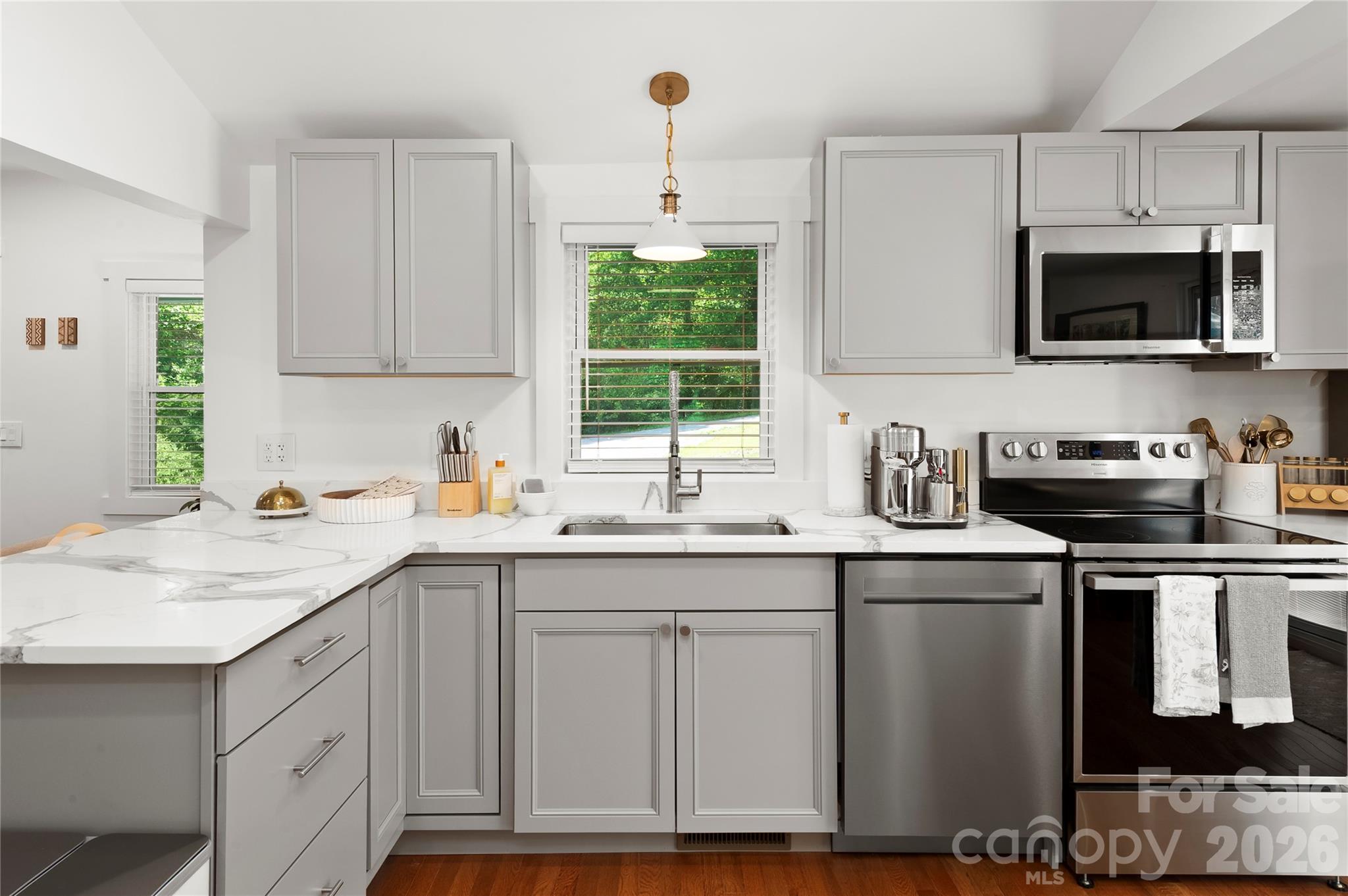 Gorgeous custom white quarts counter tops and brand new cabinetry. - 121 Sugar Cove Road, Weaverville